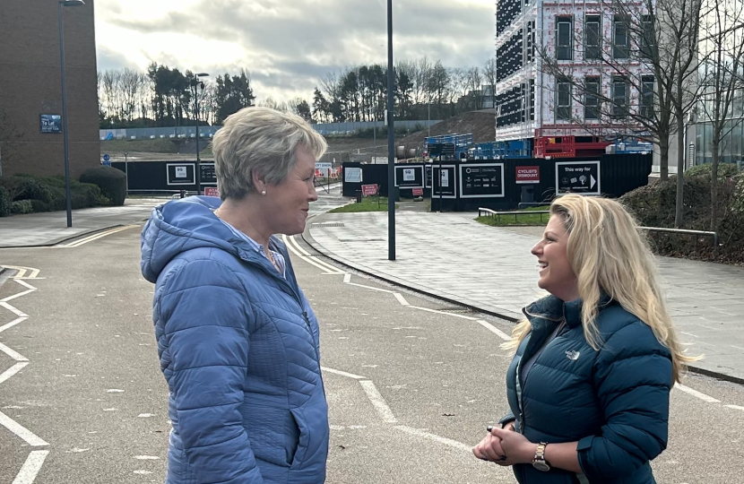 Hannah and a lady outside of the building site of the Station Quarter developement. 