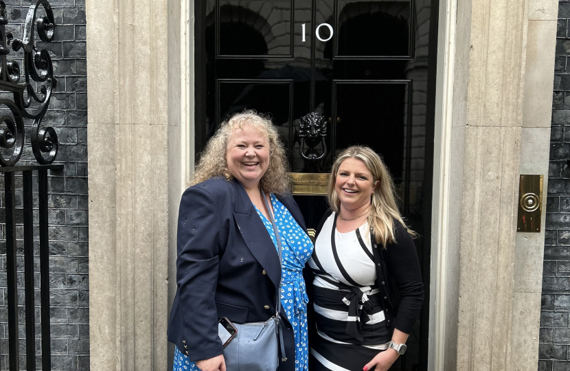 Hannah and Samantha outside of the number 10 front door.