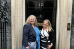 Hannah and Samantha outside of the number 10 front door.